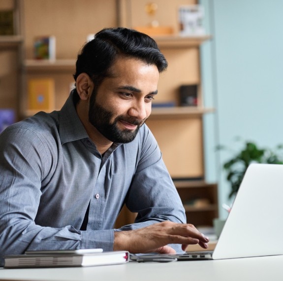 Man typing on laptop